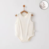 Close-up of 100% pure cotton fabric on baby onesie, soft and breathable weave