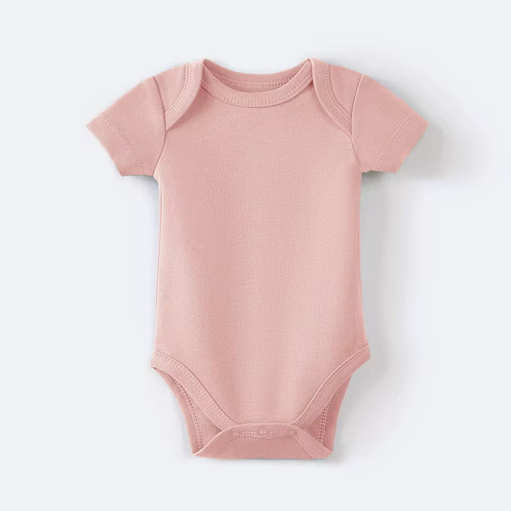 Organic pink cotton baby bodysuit made from GOTS-certified organic cotton