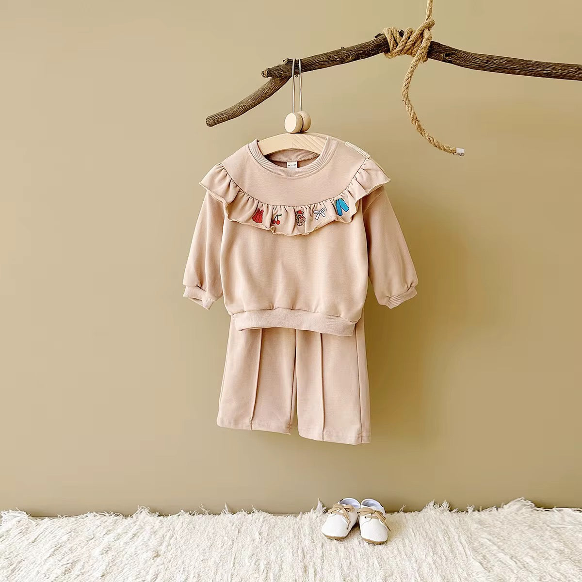 long-sleeve flounce top with embroidered mini icons