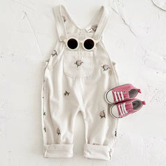 Embroidered floral baby overalls in soft cream corduroy front view