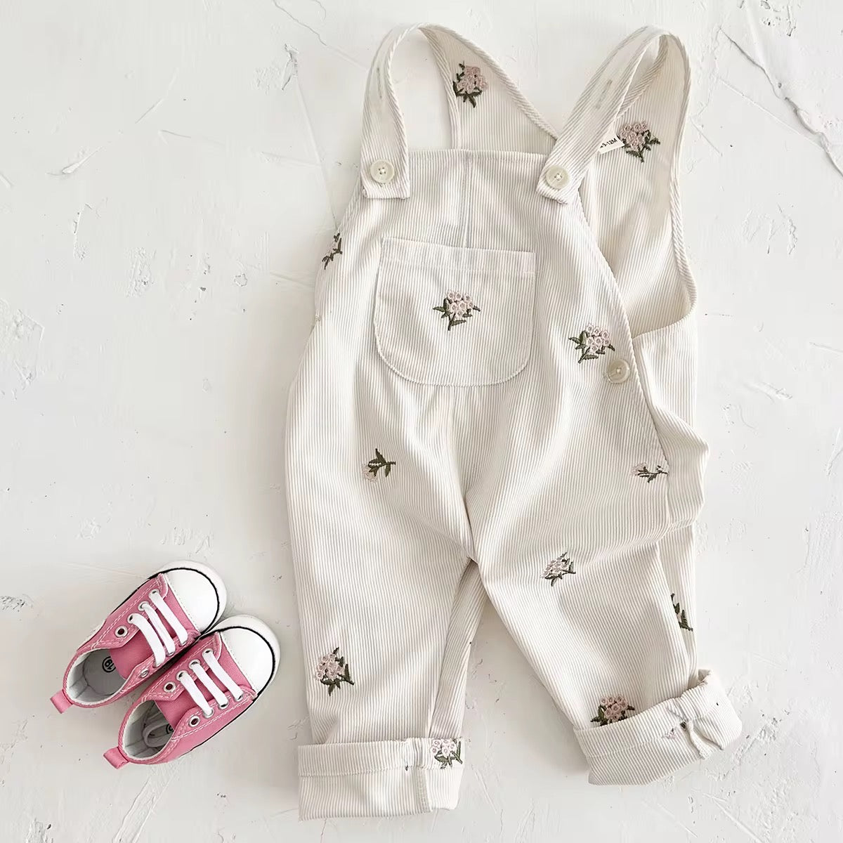 White overalls with floral embroidery