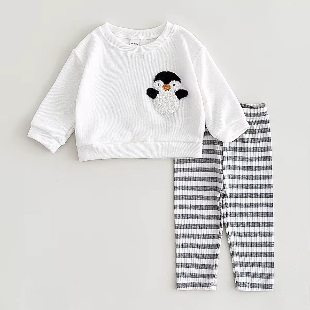 Textured penguin patch on baby pullover